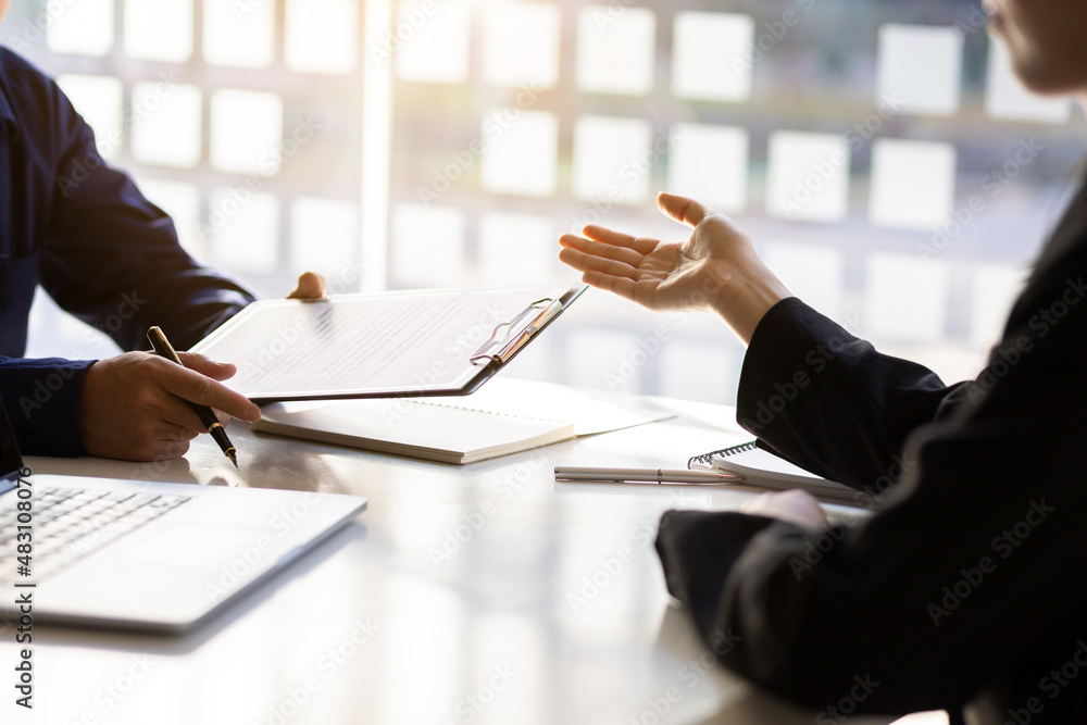 Applicants submit resumes and job interviews. Businessman holding a resume is interviewing for a job