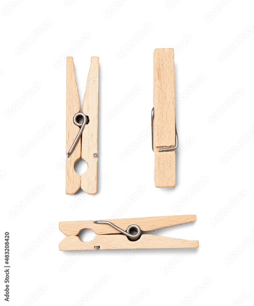 Wooden clothespins on white background