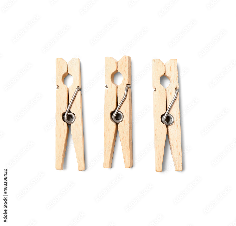 Wooden clothespins on white background