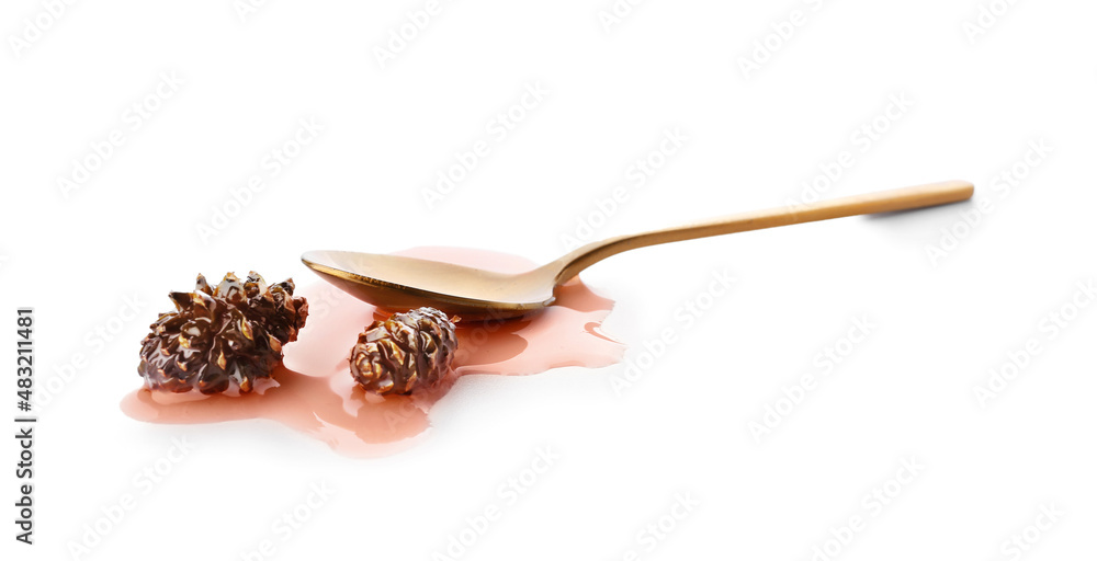 Spoon of tasty pine cone jam on white background