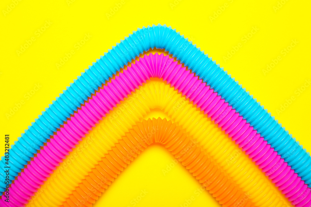 Pop Tubes on yellow background