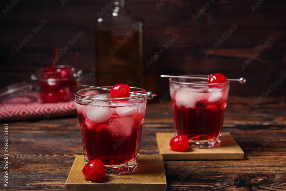 Glasses of tasty Manhattan cocktail on table