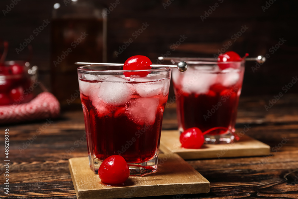 Glasses of tasty Manhattan cocktail on table