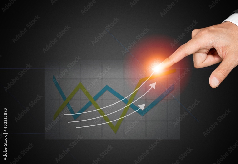 Analyzing and data exchange. Businessman draws growth graph of business. Business strategy