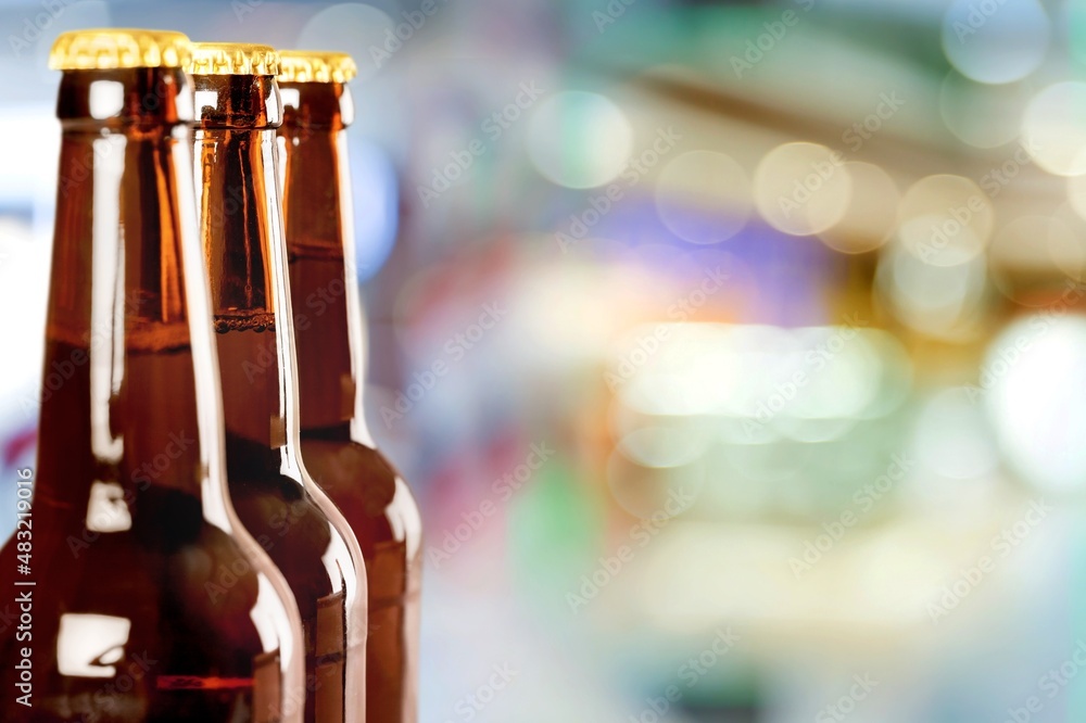 Fresh beer in glass bottle in a bar