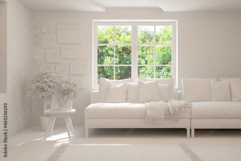 Minimalist living room in white color with sofa and summer landscape in window. Scandinavian interio