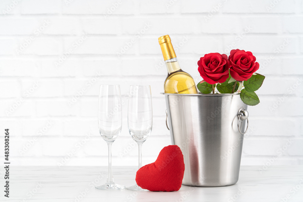 Valentines Day celebration with wine and rose bouquet