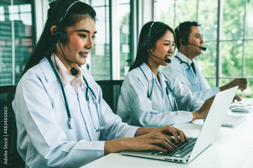 Doctor team wearing headset talking actively on video call in hospital clinic . Concept of telehealt