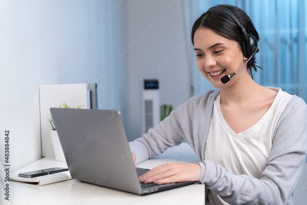 Asian young beautiful businesswoman working at home during night time.