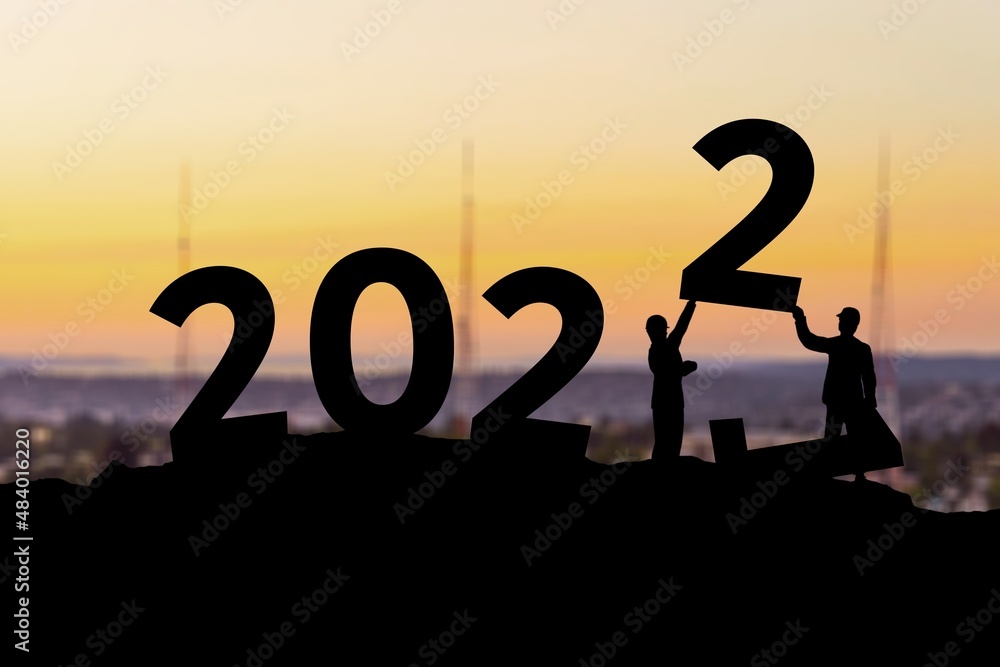 2022 New Year concept. Couple holding up .numbers