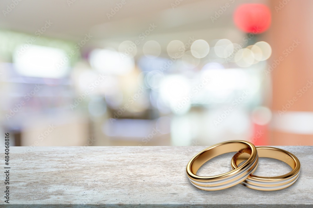 Two wedding rings at a traditional wedding on the desk.