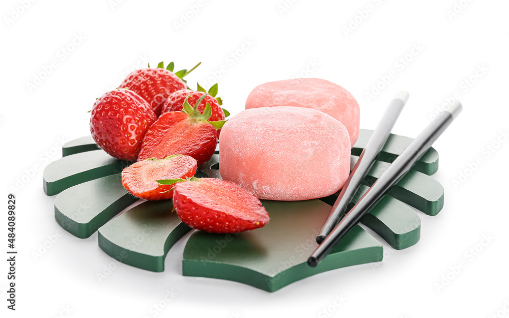 Board with delicious mochi, strawberry and chopsticks on white background