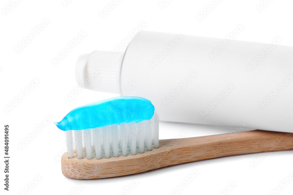 Tooth brush and paste on white background, closeup