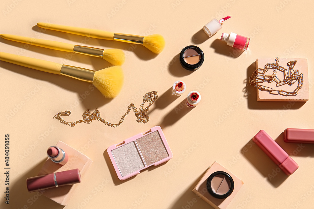 Decorative cosmetics on beige background