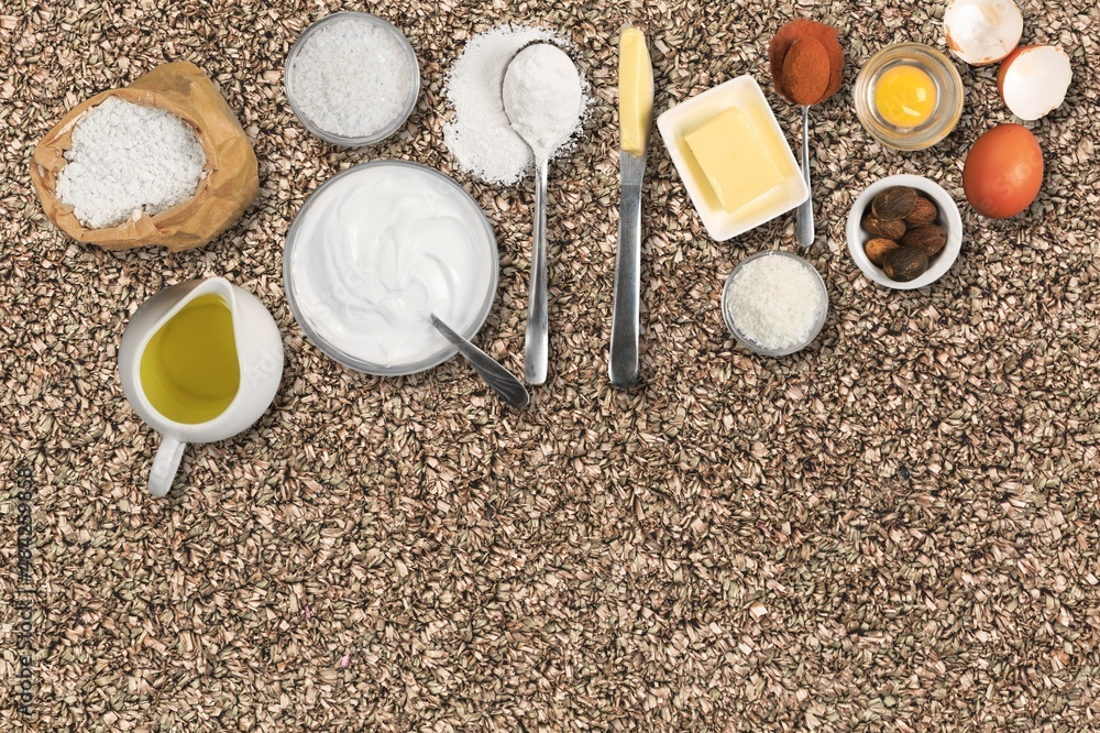 New Year in the kitchen.  A piece of dough, eggs and a wooden rolling pin lies on a granite countert