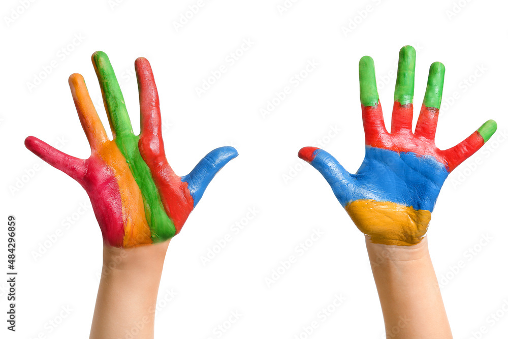 Childs hands in paints on white background