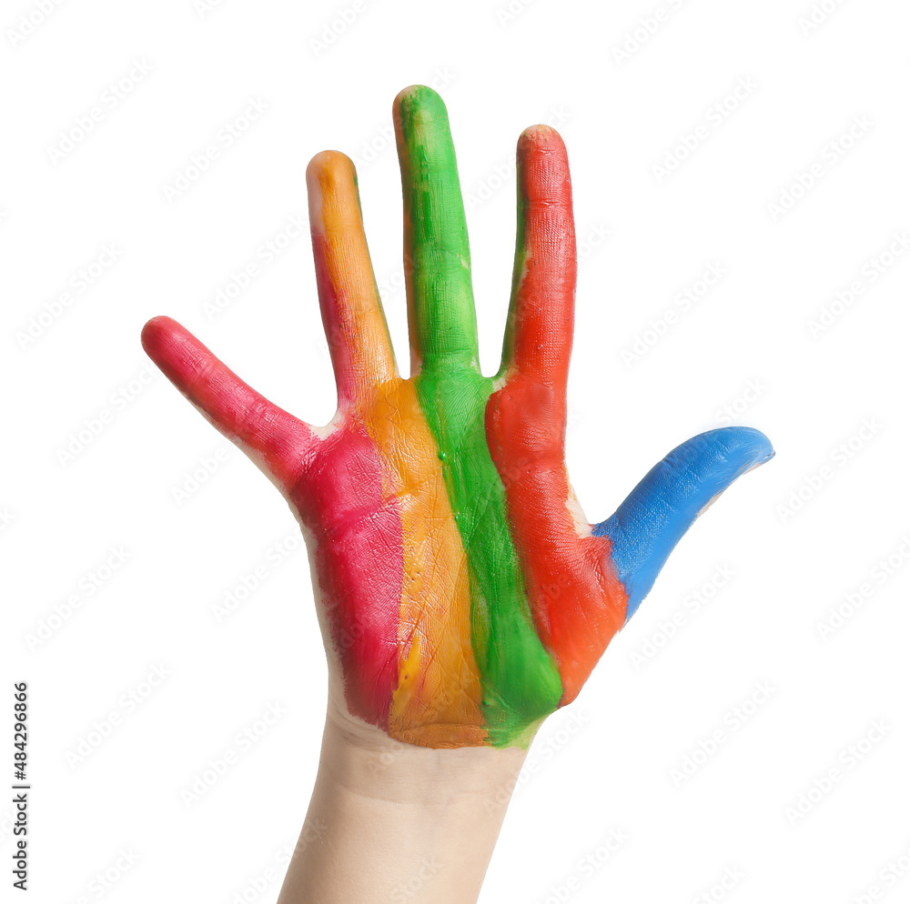 Childs hand in paint on white background