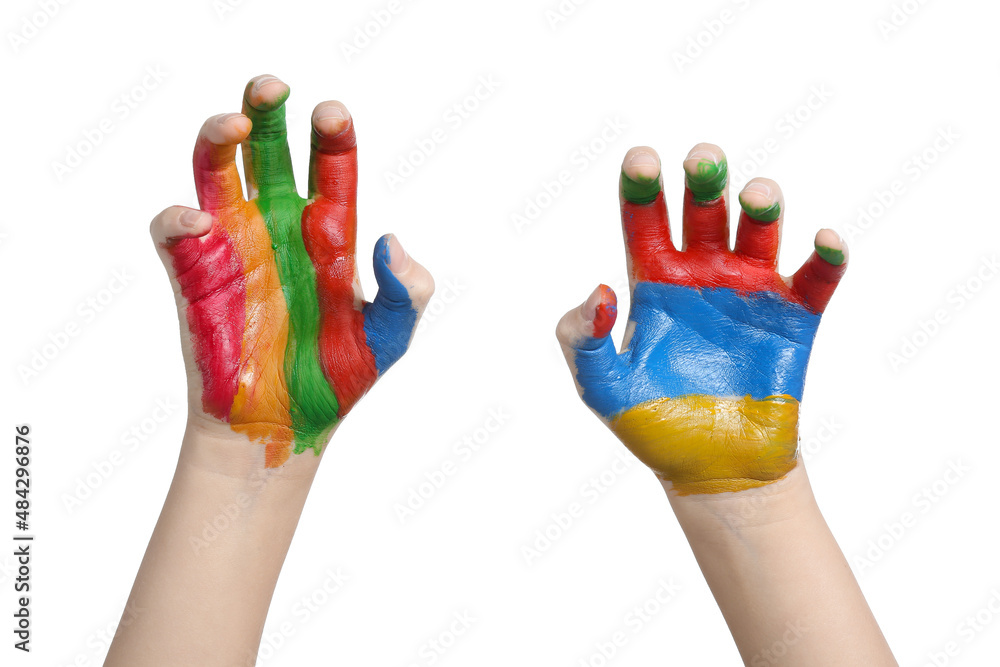 Childs hands in paints on white background