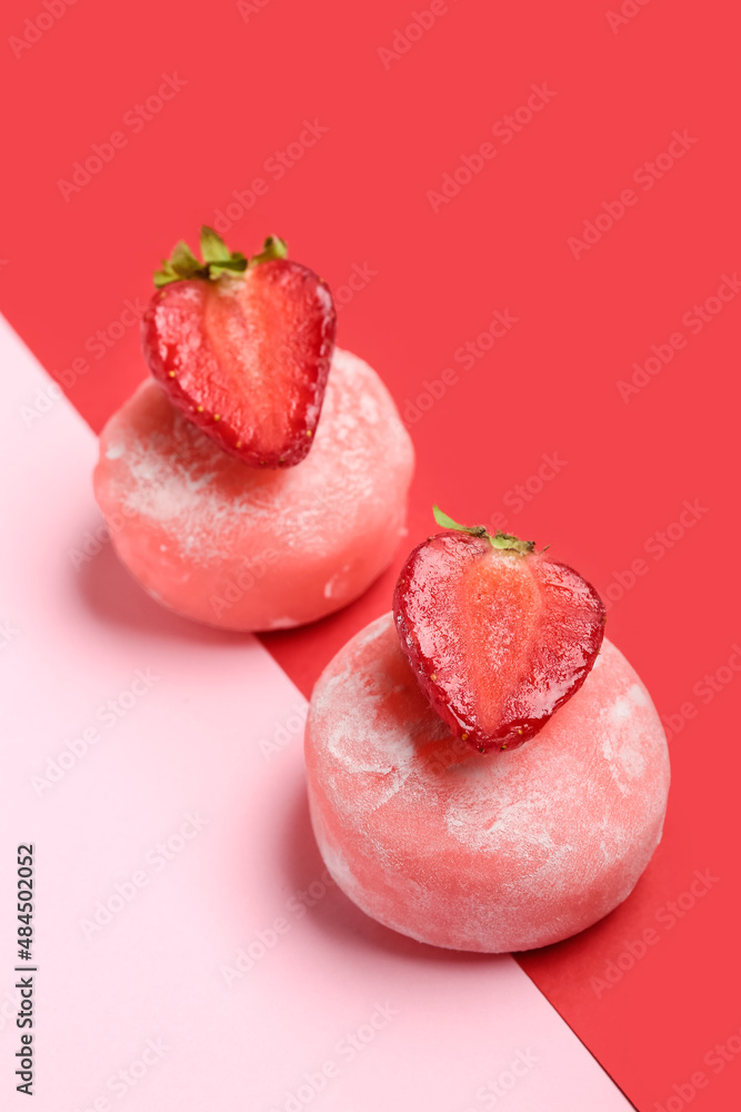 Delicious mochi, strawberry and chopsticks on color background