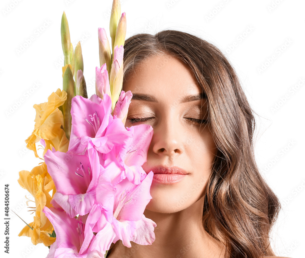 Beautiful woman with closed eyes and bouquet of Gladiolus flowers on white background