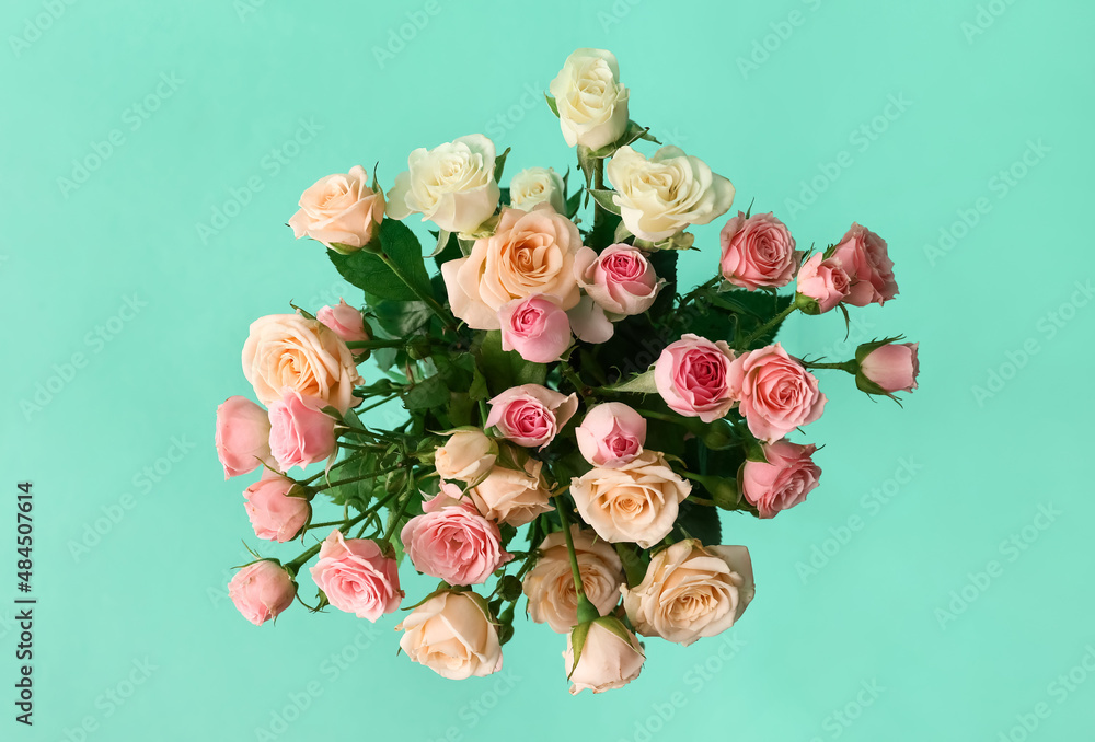 Bouquet of roses on green background