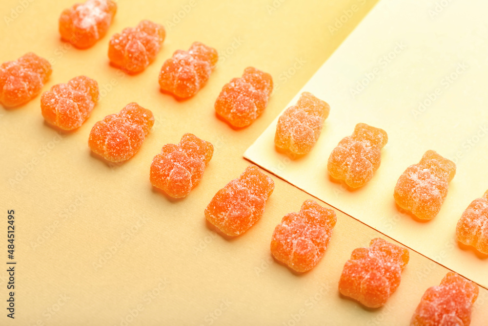 Tasty jelly bears on color background