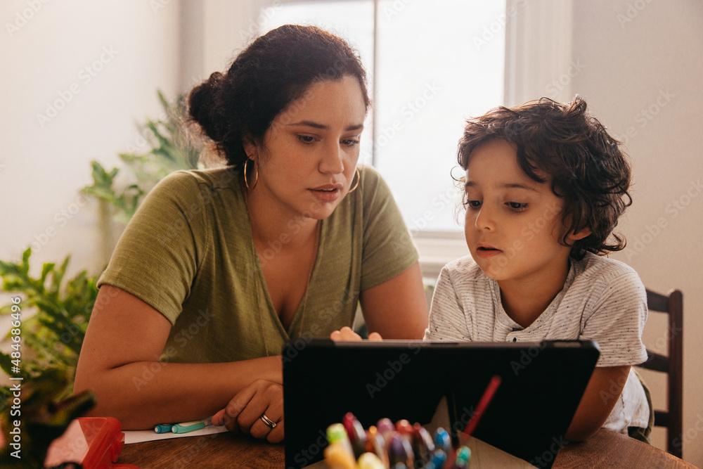 Single mother home schooling her son