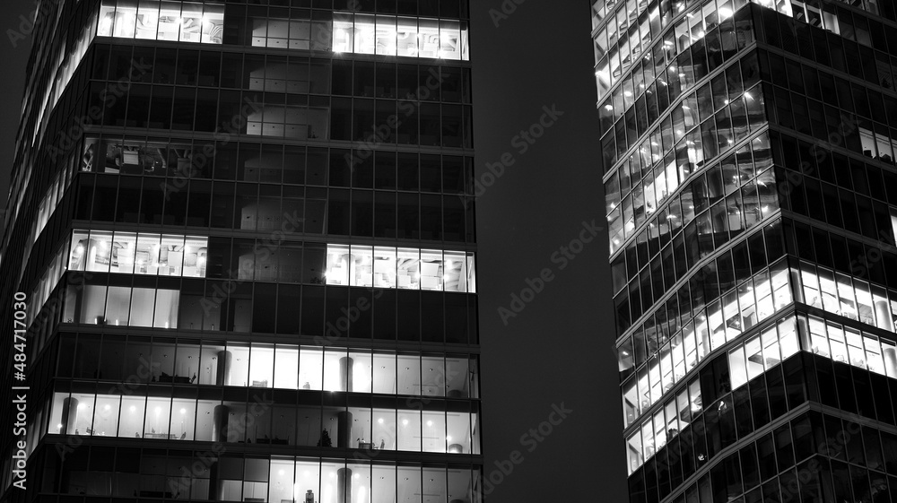 Amazing night cityscape. Office building at night, building facade with glass and lights. View with 