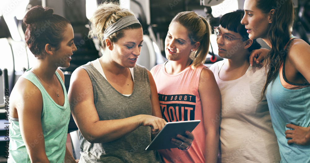 Just download this app.... Cropped shot of a group of young women looking at a digital tablet in the