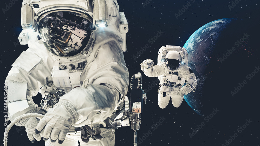 Astronaut spaceman do spacewalk while working for spaceflight mission at space station . Astronaut w