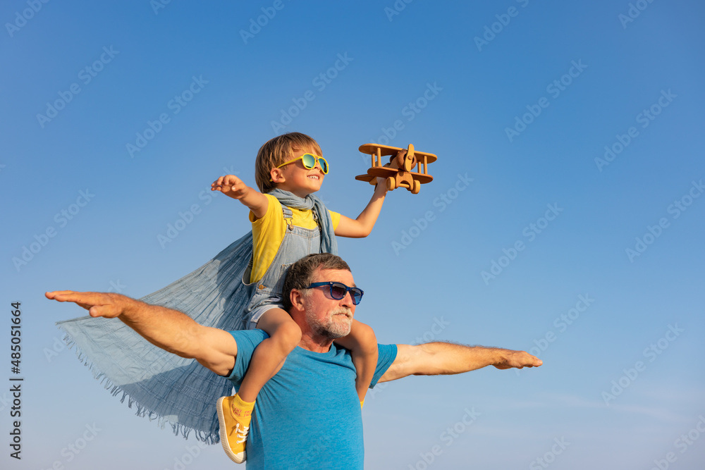 Grandfather and boy having fun outdoor