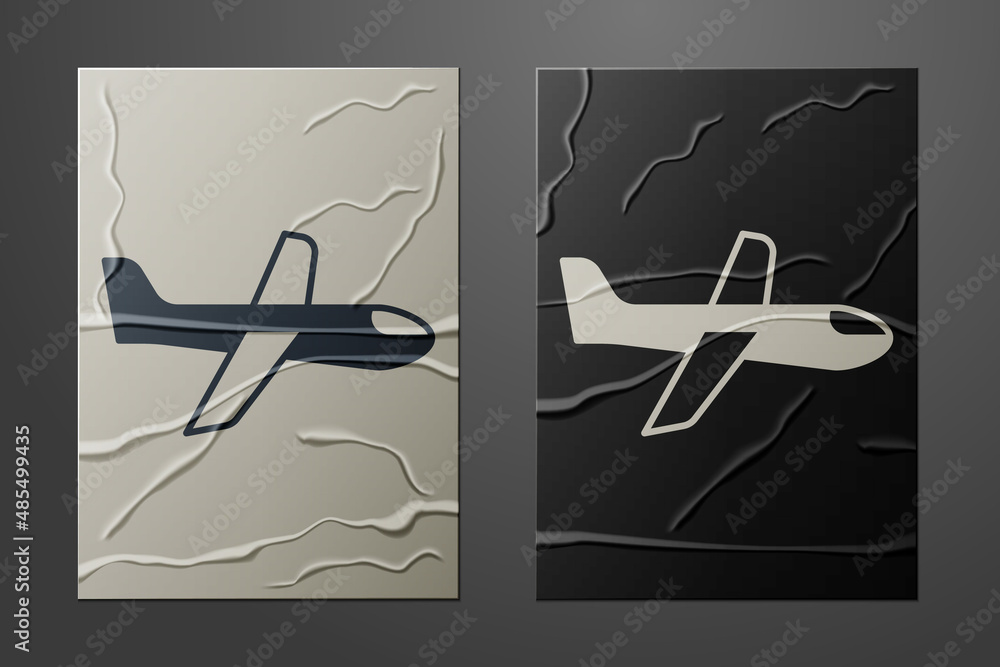 White Plane icon isolated on crumpled paper background. Flying airplane icon. Airliner sign. Paper a