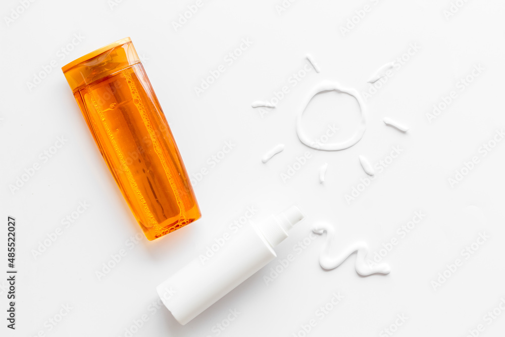 Suntanning lotion with cream in shape of sun, top view