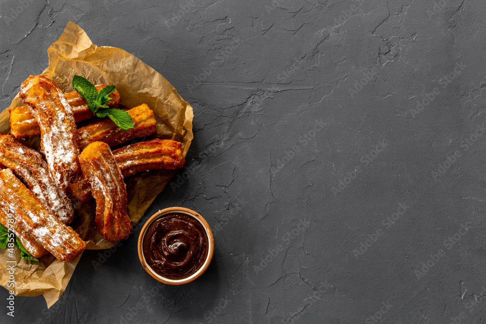 Spanish churros waffles on baking paper, top view