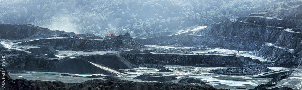 Panorama of diabase (dolerite) quarry in Parekklisia, Cyprus with piles of crushed stone and working