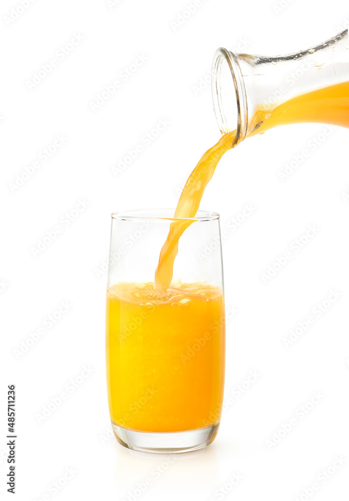 Pouring orange juice into the glass isolated on white background.