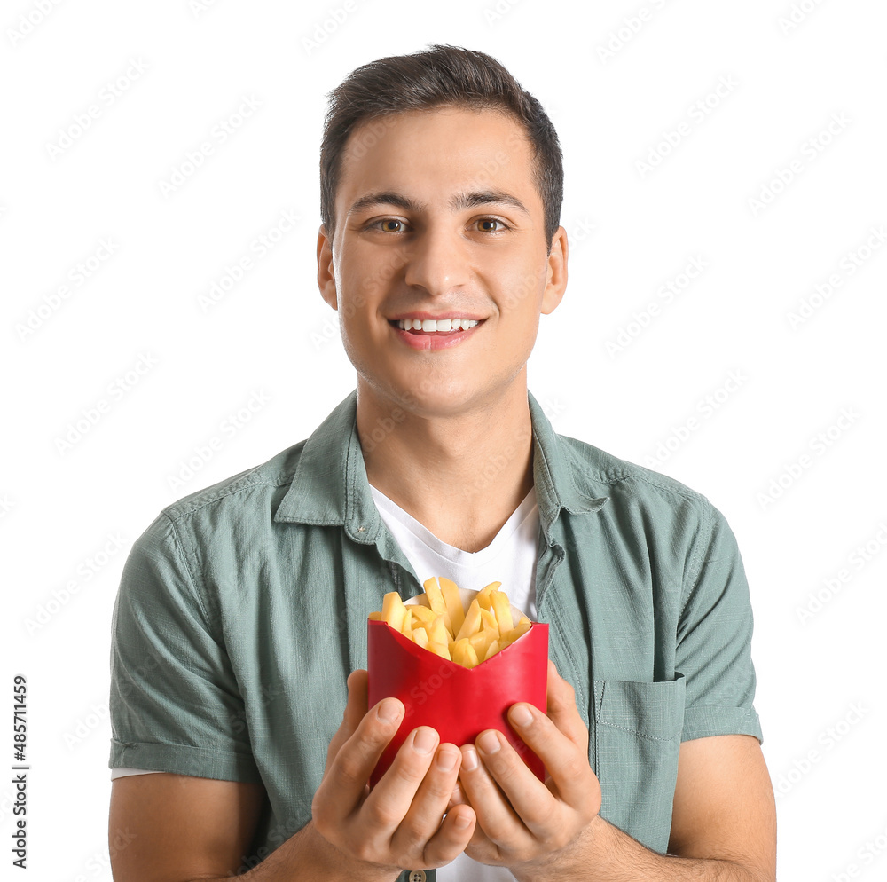 Happy young man with french fries on white background