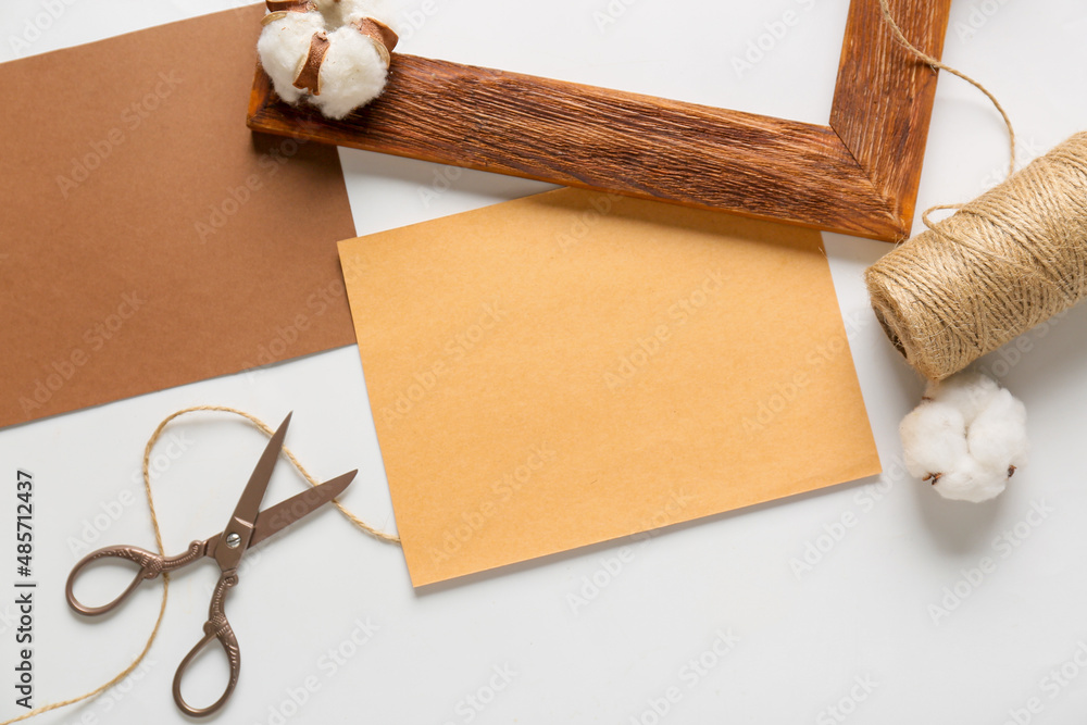 Blank cards, rope and scissors on white background, closeup