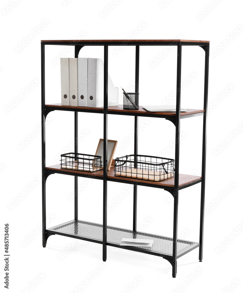 Shelf unit with folders, laptop, baskets and blank photo frame on white background