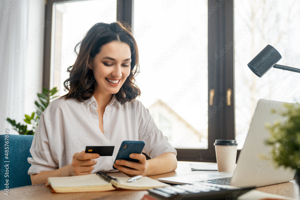 Woman is doing online purchases