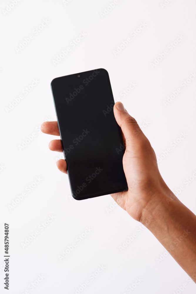 Use this code to get discount. Studio shot of an unrecognizable woman holding a cellphone against a 