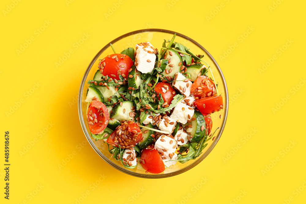 Bowl with healthy vegetable salad on color background