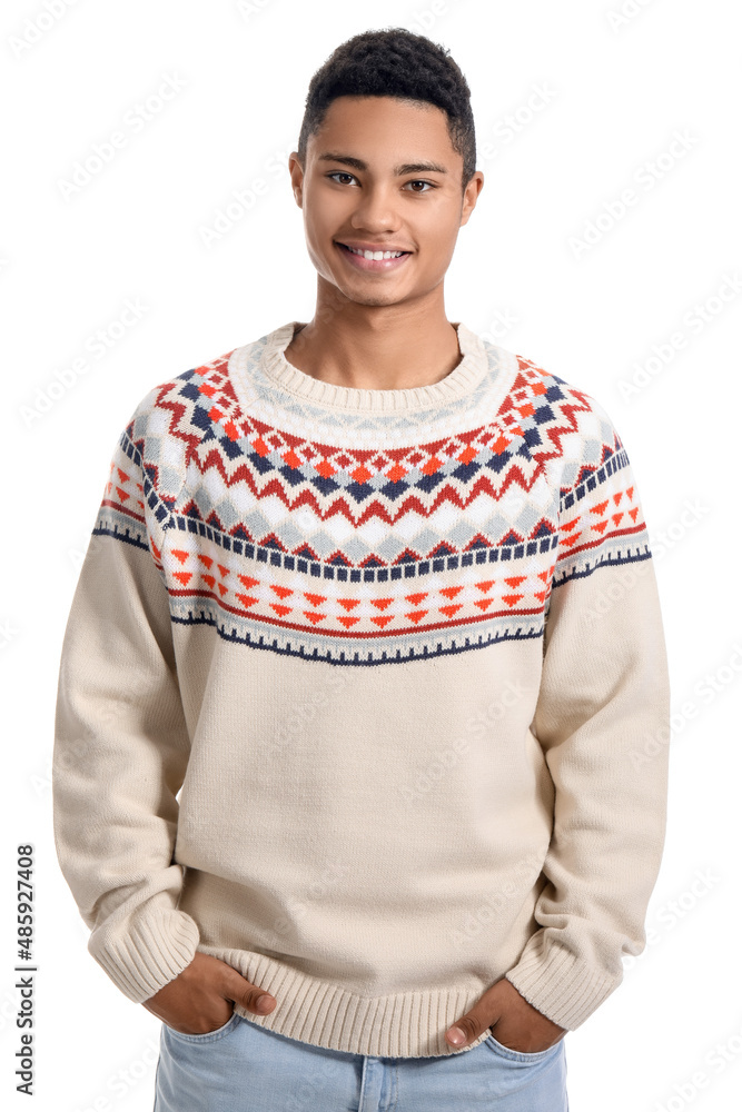 Handsome African-American guy in knitted sweater on white background