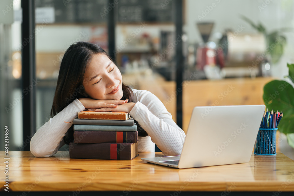 Wake up lazy woman, time to learn english language! Tired student sleeping on books at library. Port