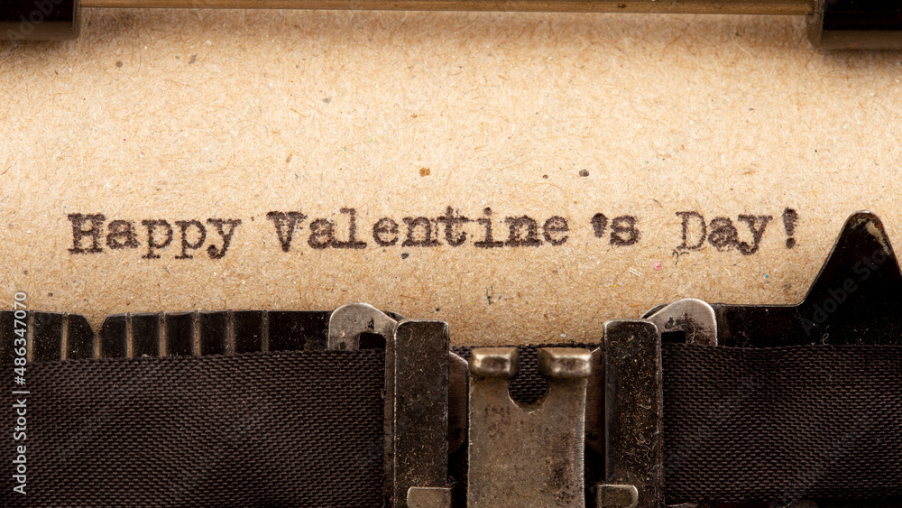 Happy Valentine`s day - phrase on typewriter. Valentines Day greetings concept. Valentines greeting 