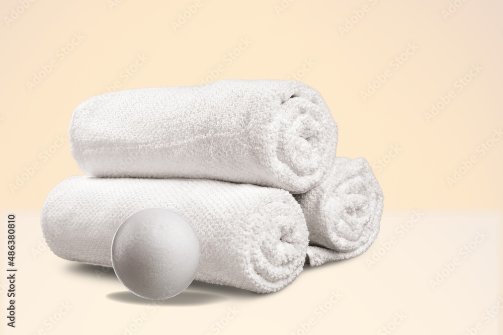 Wool Dryer Balls On White Towel. Eco Friendly Laundry Supplies. Alternative Drying Of Linen.