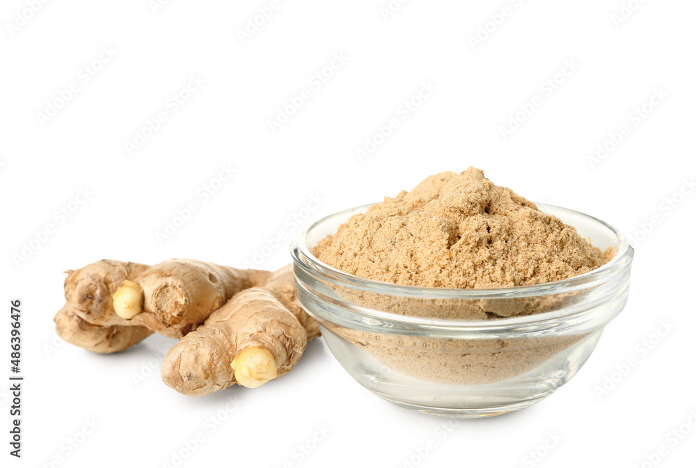 Bowl of ginger powder and roots on white background