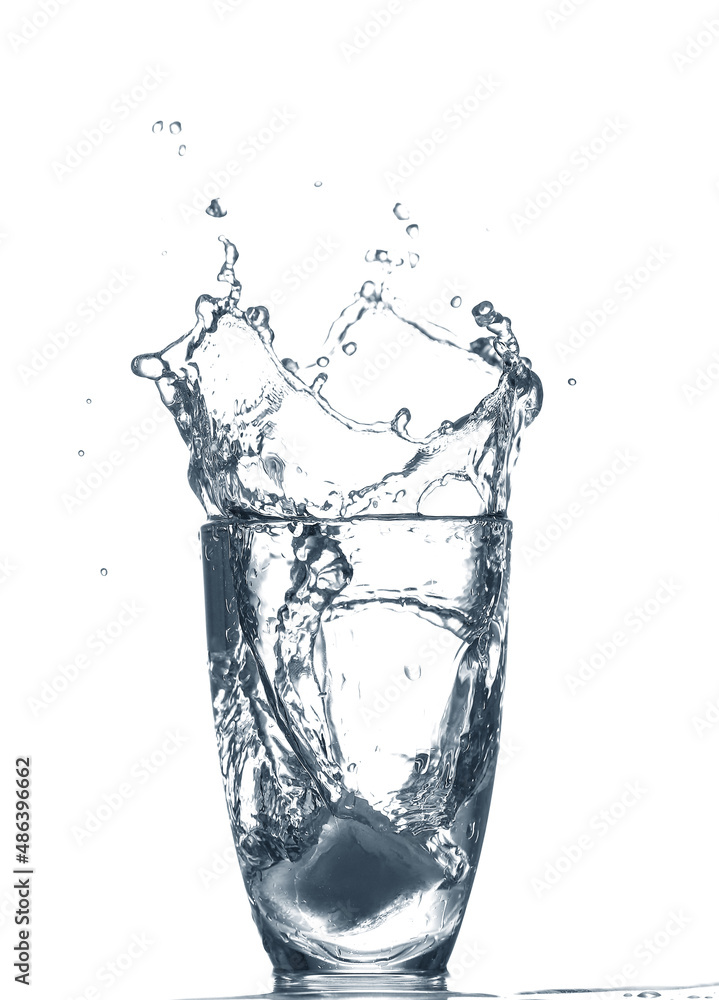 Glass of clear water with splash isolated on white