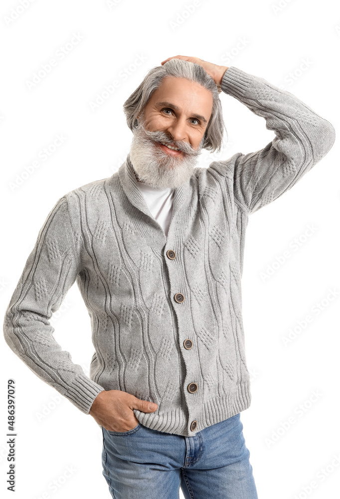 Handsome senior man in knitted sweater on white background