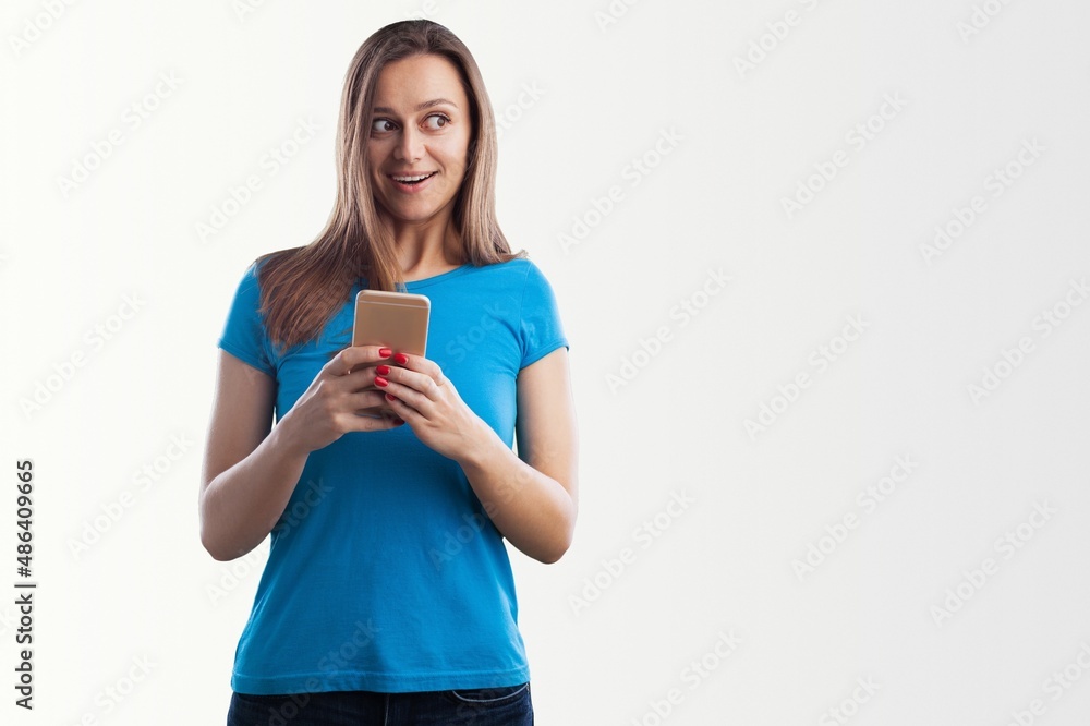 Portrait photo of young beautiful woman feeling happy or surprise shock and holding smart phone